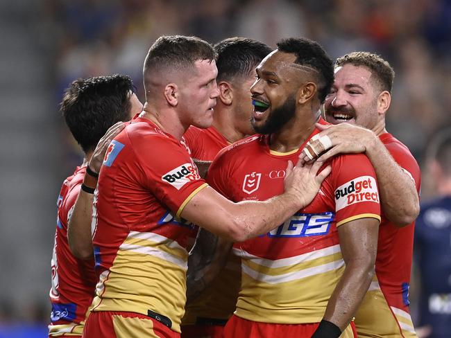 TOWNSVILLE, AUSTRALIA - APRIL 07: Tom Gilbert of the Dolphins celebrates after scoring a try during the round six NRL match between North Queensland Cowboys and Dolphins at Qld Country Bank Stadium on April 07, 2023 in Townsville, Australia. (Photo by Ian Hitchcock/Getty Images)