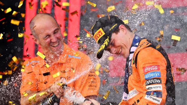 McLaren race engineer Tom Stallard sprays race winner Oscar Piastri with celebratory champagne. Picture: Getty Images