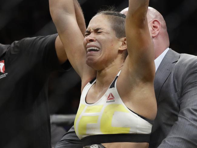 Amanda Nunes celebrates after defeating Miesha Tate during their women's bantamweight championship mixed martial arts bout at UFC 200, Saturday, July 9, 2016, in Las Vegas. (AP Photo/John Locher)