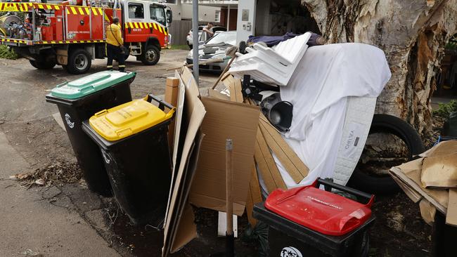 Household items that have been thrown out on Rolfe St, Manly, ready to be collected as part of the clean-up effort after Tuesday’s northern beaches flood emergency. Picture: Tim Hunter.