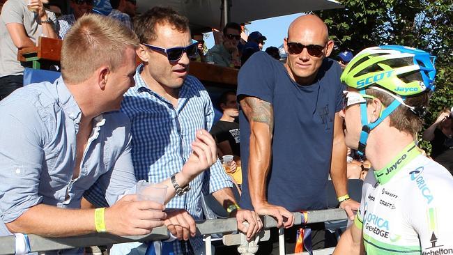  Baden Cooke and Michael Klim talk to cyclist Simon Clarke at Sunday's People's Choice Classic. Picture: Sarah Reed. 