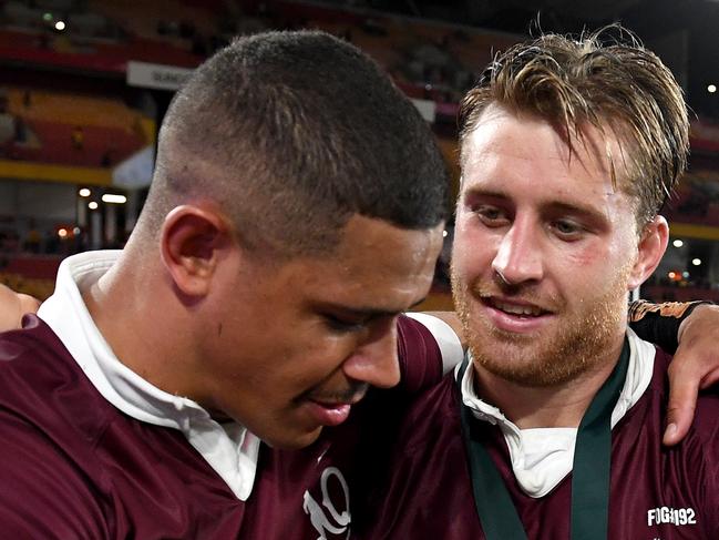 BRISBANE, AUSTRALIA - NOVEMBER 18:  Cameron Munster and  Dane Gagai of the Maroons embrace as they celebrate victory after game three of the State of Origin series between the Queensland Maroons and the New South Wales Blues at Suncorp Stadium on November 18, 2020 in Brisbane, Australia. (Photo by Bradley Kanaris/Getty Images)