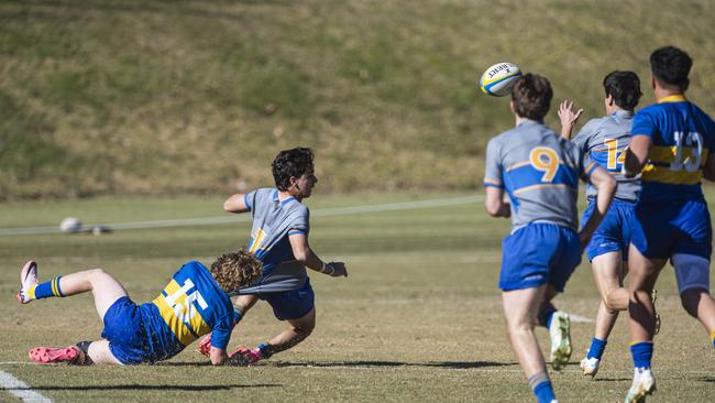 Will Bloxham sets up a try with a pass playing for Churchie. He made the Tigers Meninga Cup squad. Picture: Kevin Farmer