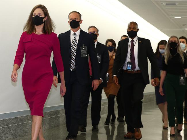 Supreme Court nominee Judge Amy Coney Barrett walks back after a break in the Senate Judiciary Committee confirmation hearing on Capitol Hill. Picture: Getty Images/AFP