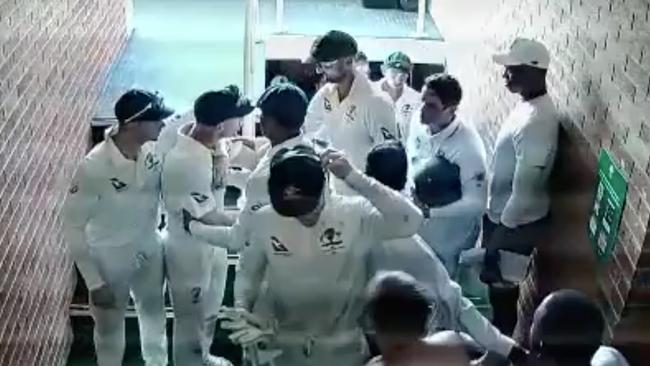 David Warner is restrained by teammates during the second Test.