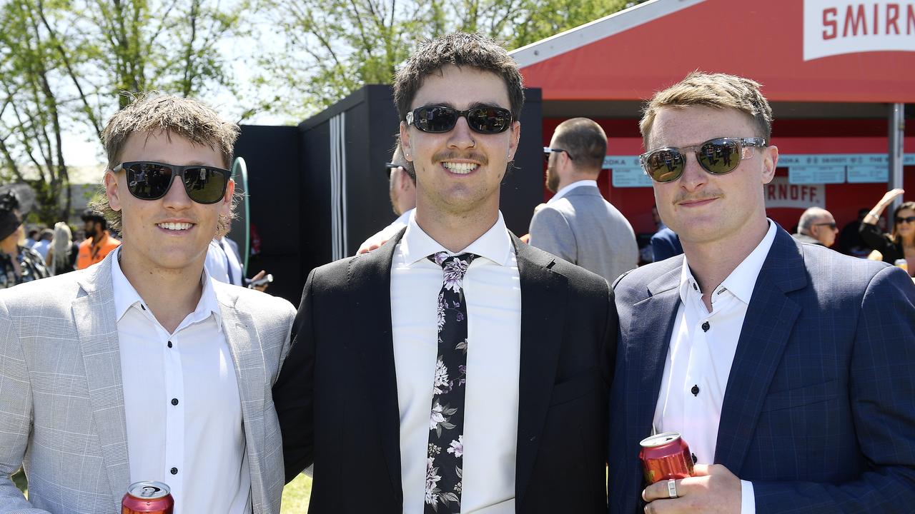 Caulfield Guineas horse race meeting, Caulfield, Victoria, Saturday 12th October 2024. Faces in the crowd. Pictured enjoying the race meeting are Max, Liam and Liam. Picture: Andrew Batsch