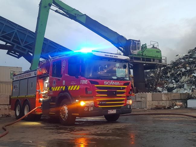 Firefighters tackling the pile of burning waste. Picture: Uniform Photography