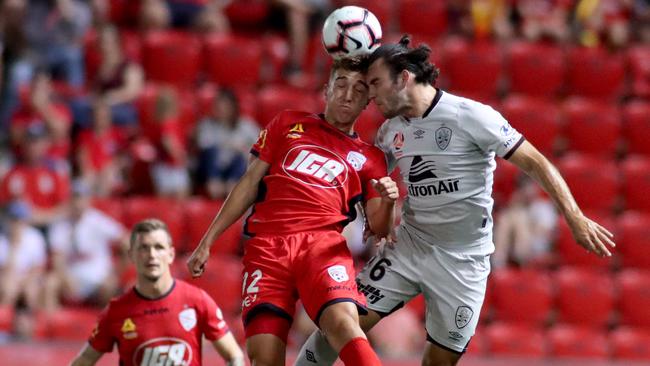 Adelaide United’s Carlo Armiento has been chased by Melbourne City. Armiento seen heading the ball away from Brisbane Roar’s Nicholas D'Agostino before providing an assist in a thrilling 4-3 win for the Reds in February at Coopers Stadium (AAP Image/Kelly Barnes)