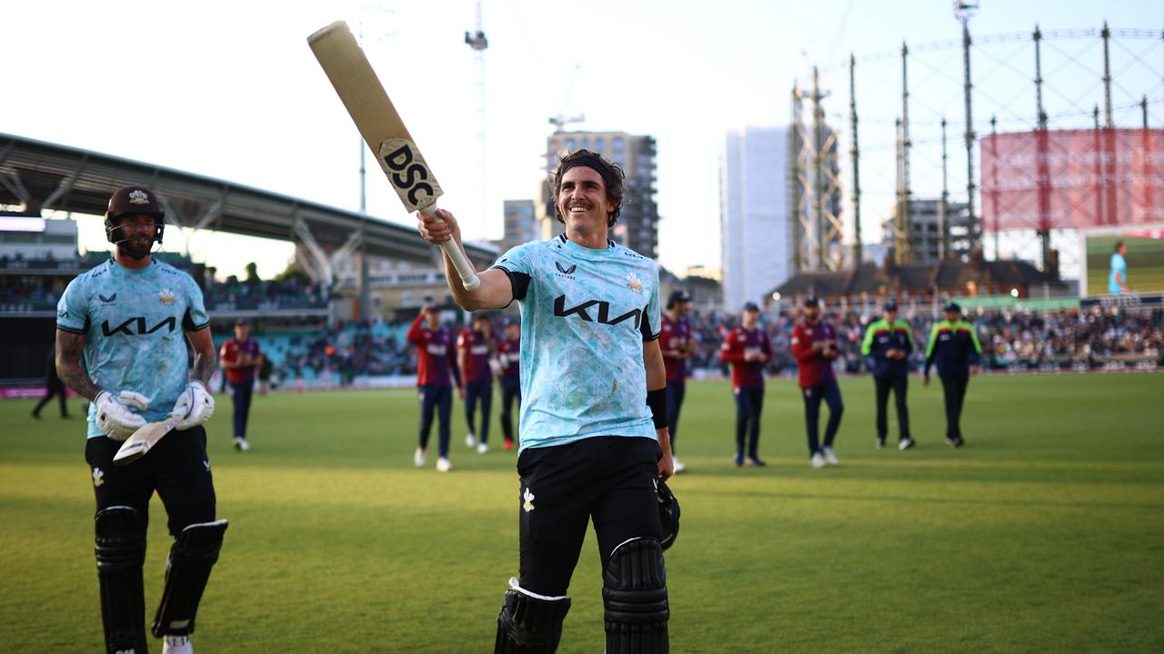 Sean Abbott acknowledges the crowd as he leaves the field after making a century. (Photo by Ben Hoskins/Getty Images for Surrey CCC)