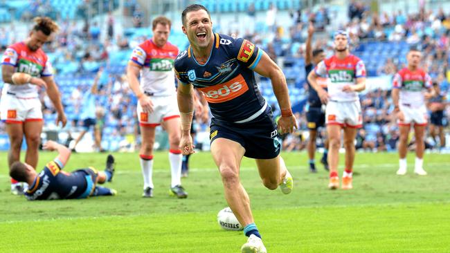 Michael Gordon celebrates a try for the Titans. Picture: Bradley Kanaris/Getty Images