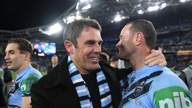 Blues coach Brad Fittler (left) celebrates with Boyd Cordner during Game 3 of the 2019 State of Origin series between the New South Wales Blues and the Queensland Maroons at ANZ Stadium in Sydney, Wednesday, July 10, 2019. (AAP Image/Dan Himbrechts) NO ARCHIVING, EDITORIAL USE ONLY