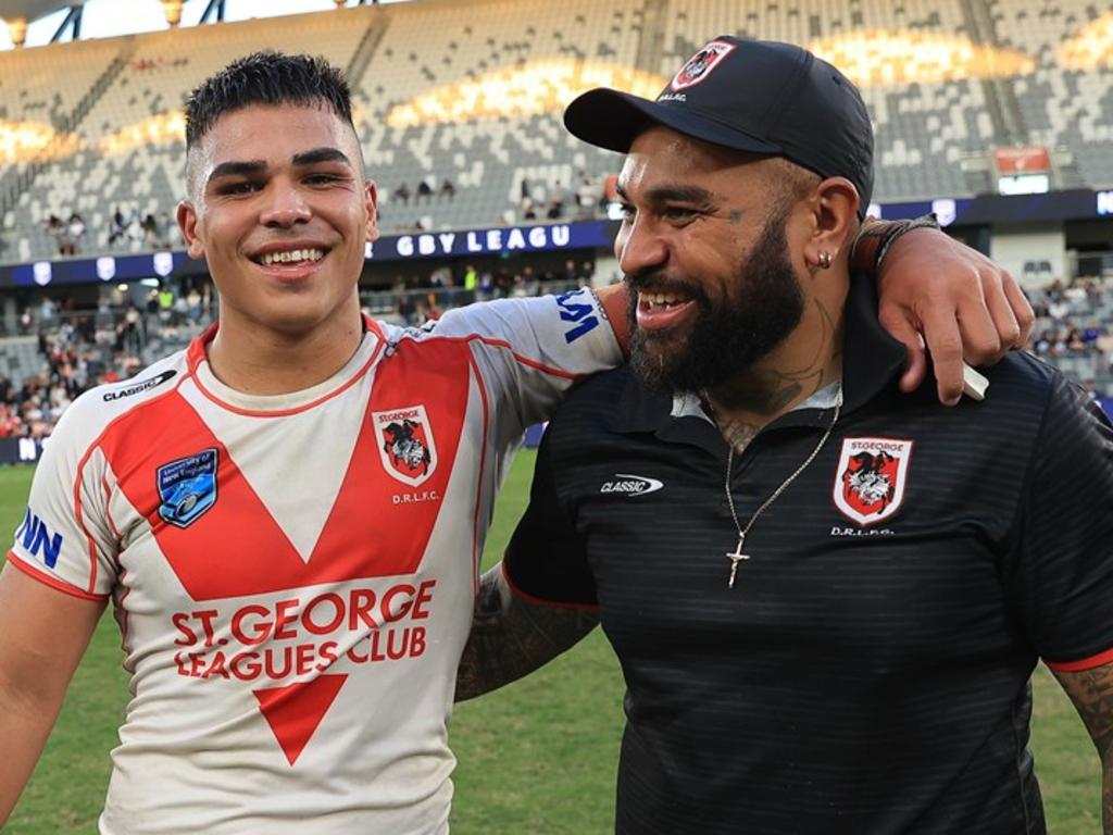 Jacob Halangahu with dad, Toa, after winning the SG Ball Cup with the Dragons. Picture: Dragons