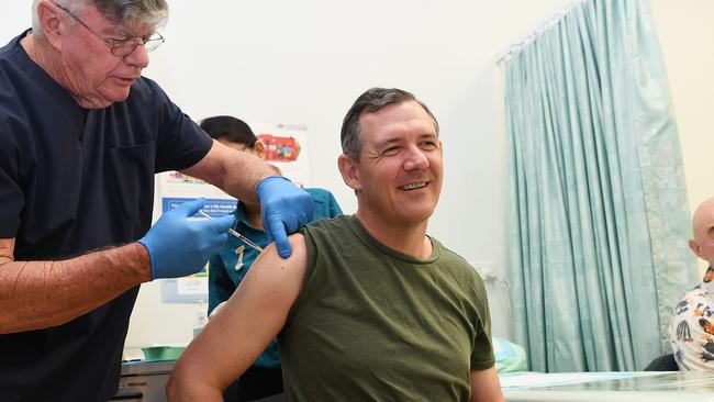 Dr Lionel Crompton gives Chief Minister Michael Gunner the first dose of the coronavirus vaccine, Picture Katrina Bridgeford.