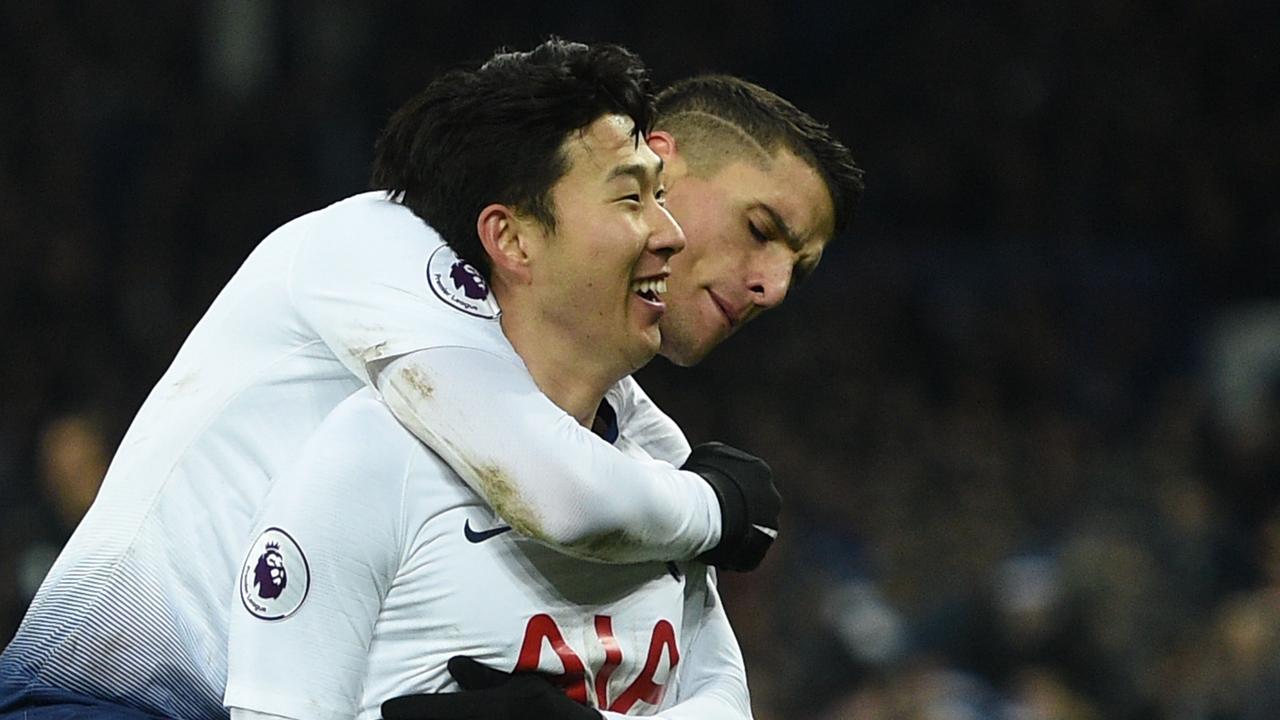 Tottenham Hotspur's South Korean striker Son Heung-Min (L) celebrates scoring their fifth goal with Tottenham Hotspur's Argentinian midfielder Erik Lamela (R) during the English Premier League football match between Everton and Tottenham Hotspur at Goodison Park in Liverpool, north west England on December 23, 2018. (Photo by Oli SCARFF / AFP) / RESTRICTED TO EDITORIAL USE. No use with unauthorised audio, video, data, fixture lists, club/league logos or 'live' services. Online in-match use limited to 120 images. An additional 40 images may be used in extra time. No video emulation. Social media in-match use limited to 120 images. An additional 40 images may be used in extra time. No use in betting publications, games or single club/league/player publications. /