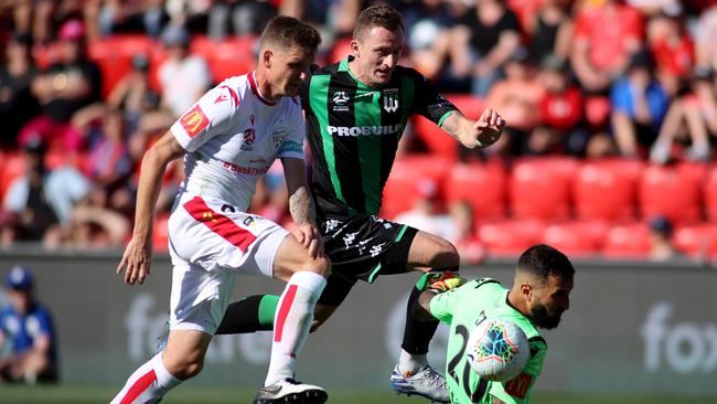 Besart Berisha competes against Michael Jakobsen and Paul Izzo. Picture: AAP Image/Kelly Barnes.