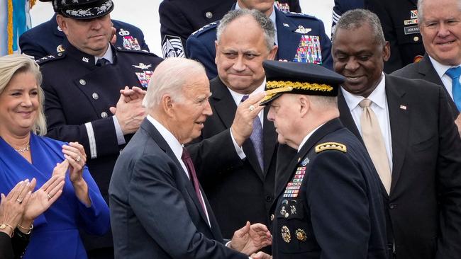 ‘That’s leadership’: Joe Biden and Mark Milley shake on it. Picture: AFP