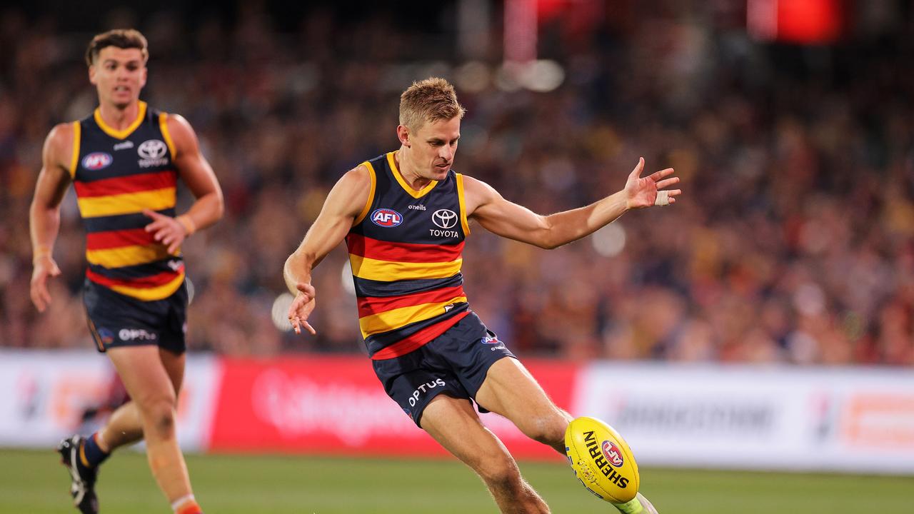 Adelaide’s David Mackay kicks the ball during his side’s narrow win over the Demons. Picture: Daniel Kalisz/Getty Images