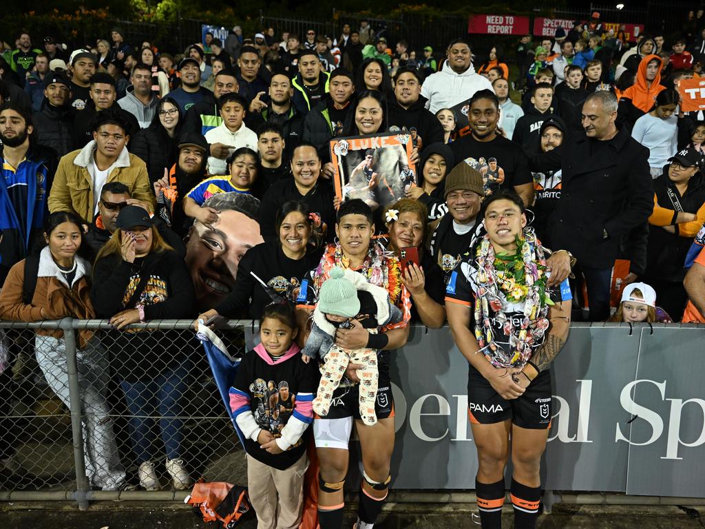 The brothers celebrate with family on Luke’s debut in Round 16 2024. Picture: NRL Imagery