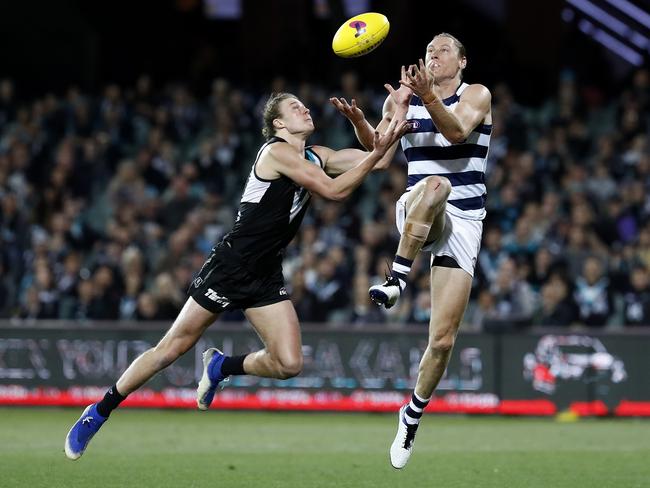 Xavier Duursma and Mark Blicavs moments before they collide. Picture: Ryan Pierse (Getty)