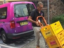 Northern Beaches Council employee John Farrell gets books ready for the council's new Library2U book delivery and pick-up service. Picture: Northern Beaches Council