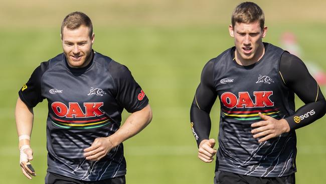 Penrith's Trent Merrin (left) training with a special guard on his finger.