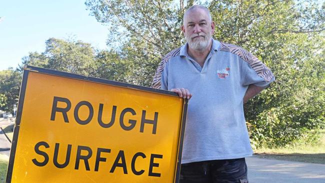 Chris Kirby is unhappy with the state of the road outside his Tweed Lane residence. Picture: Josh Preston