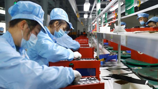 Employees in the workshop of a lithium battery manufacturing company in Huaibei, eastern China. Picture: AFP