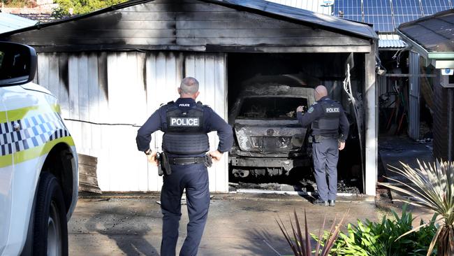 Police at the scene of the shed fire. Picture Dean Martin