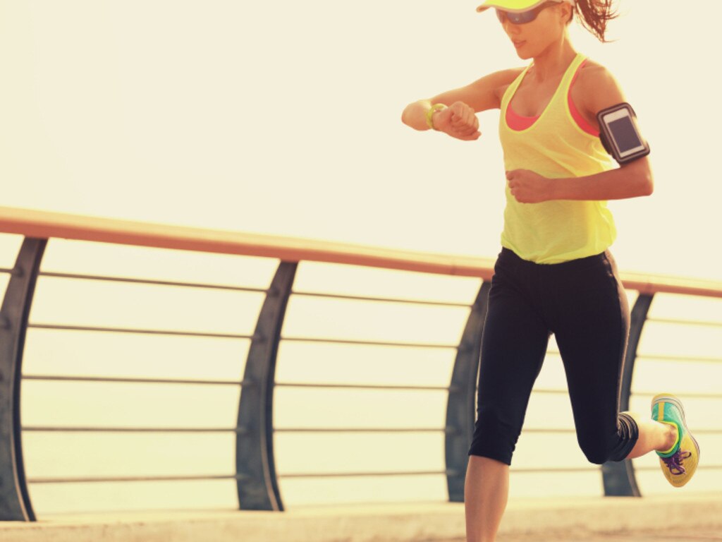 RendezView. Young fitness woman runner checking her running time from smart watch. (pic: iStock)