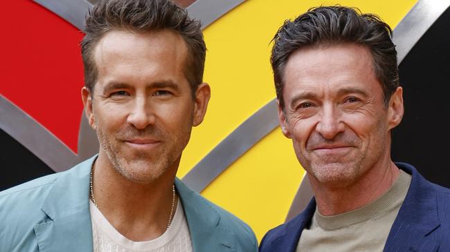 FILE - Ryan Reynolds, left, and Hugh Jackman pose for photographers upon arrival at the screening of the film 
