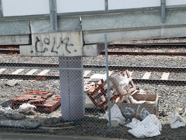 Garbage is scattered along the rail corridor. Picture: Alex Coppel.