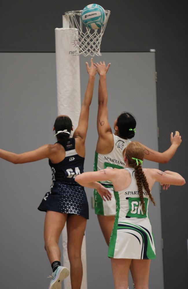 QISSN 2024 division one grand final - Canterbury College v Somerset College. Pictured: Kaylee Tamala and Maddy Rhind go for rebound