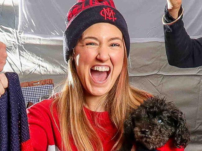 The ultimate Grand Final set up in your own backyard.  The Virtue Family L to R Darcie, Peter, Zach, Maddison, Kate and Kane with dogs Pedro and Dozer (boxer) of 6 die-hard Dees supporters. Picture: Tim Carrafa