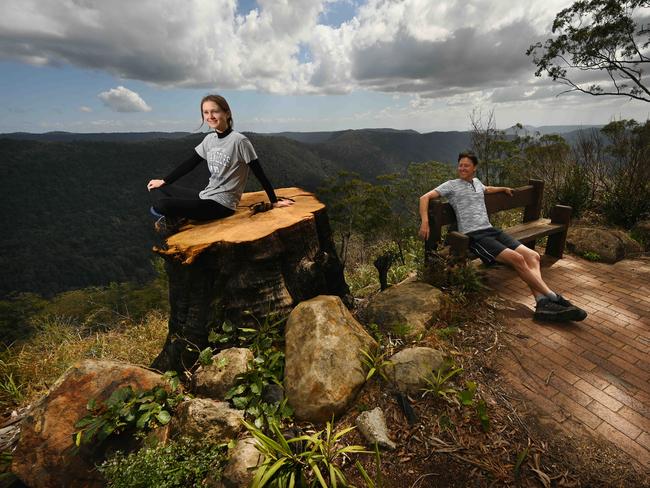 01/09/2020: Christopher Audley and Abbey Roberts, standing on the stump of a 200 yr old tree lost during the fires, return for the first time to QueenslandÃ¢â¬â¢s historic mountain retreat  Binna Burrra, high in the hills behind the Gold Coast. Binna Burra is once again open for business, the access road has reopened after the disastrous fires a year ago destroyed the famous old lodge.   Pic Lyndon Mechielsen