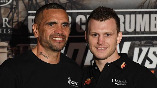 Australian boxers Anthony Mundine (left) and Jeff Horn pose for photographs  during a press conference following the River City Rumble boxing match at Suncorp Stadium in Brisbane, Friday, November 30, 2018. (AAP Image/Dave Hunt) NO ARCHIVING, EDITORIAL USE ONLY