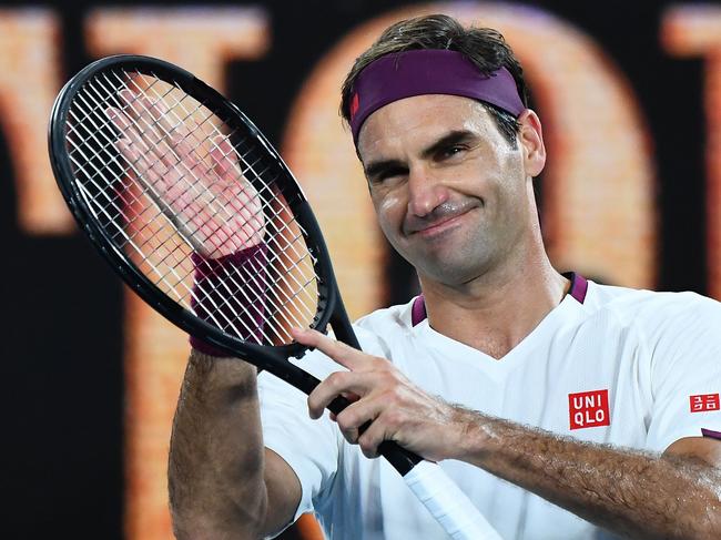 TOPSHOT - Switzerland's Roger Federer celebrates after victory against Hungary's Marton Fucsovics during their men's singles match on day seven of the Australian Open tennis tournament in Melbourne on January 26, 2020. (Photo by William WEST / AFP) / IMAGE RESTRICTED TO EDITORIAL USE - STRICTLY NO COMMERCIAL USE