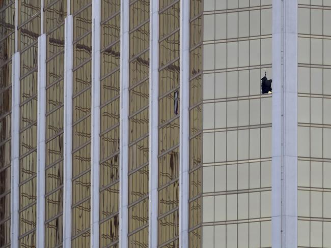 A broken window at the Mandalay Bay resort and casino is seen in the aftermath of a mass shooting on the Las Vegas Strip. Picture: Marcio Jose Sanchez/AP