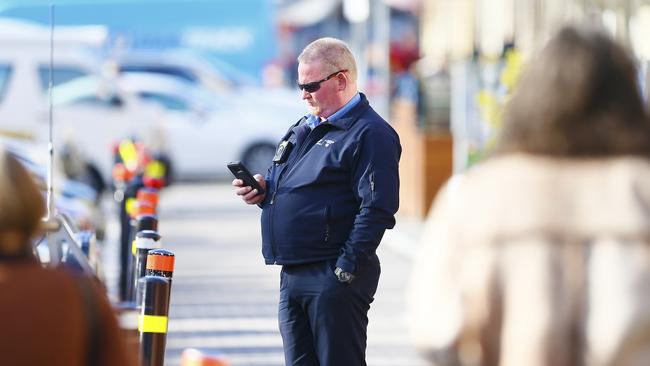 A Hobart City Council car parking officer is pictured in Salamanca Place. Picture: MATT THOMPSON