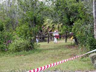 TREATED WITH CAUTION: Crews work to remove biohazard material from the property at Lagoon Pocket before a horse there was cleared of suspected hendra virus. Picture: Jacob Carson