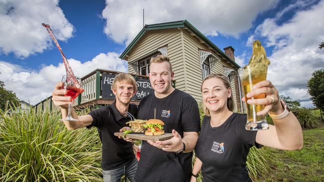 Staff from Binna Burra Lodge Scott Parker, Leighton Pitcher and Tilsa Pitcher are now operating out of a country hall while they wait for the all-clear to return to the famous property. Picture: Nigel Hallett