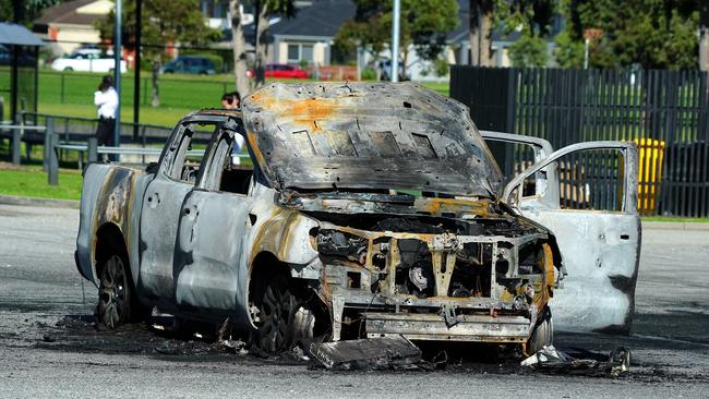 Police believe the torched ute found in Sweeney Reserve in Berwick is linked to the shooting. Picture: Luis Enrique Ascui