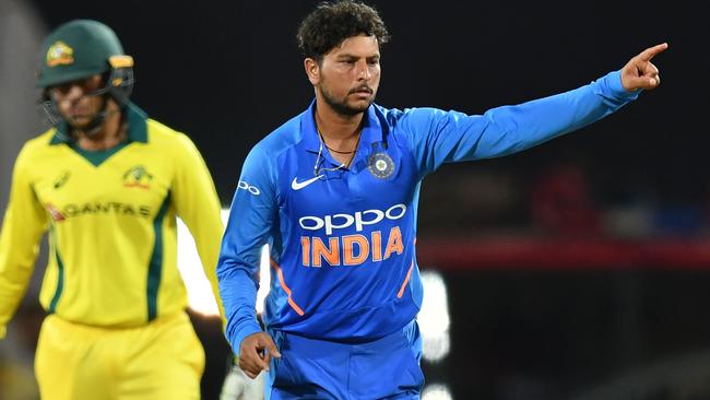 India’s Kuldeep Singh celebrates taking the wicket of Aaron Finch.