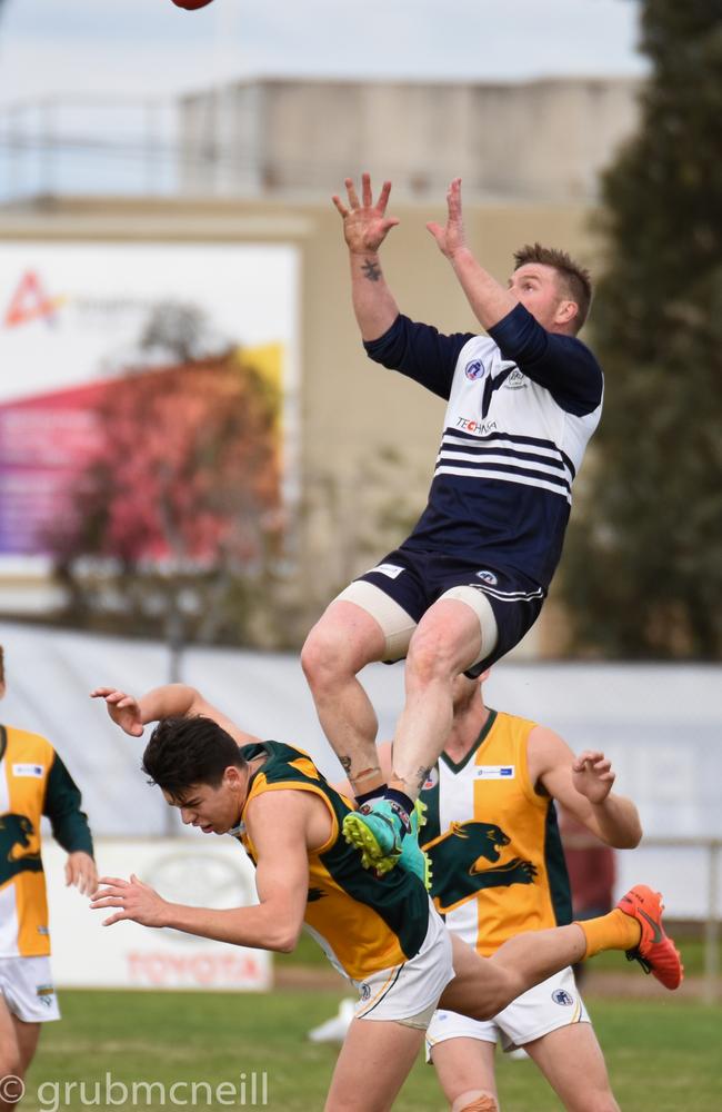 Bundoora’s Gary Moorcroft takes a hanger over Northcote Park’s Marty Hore during the NFL Division 1 elimination final. Picture: Nathan McNeill.