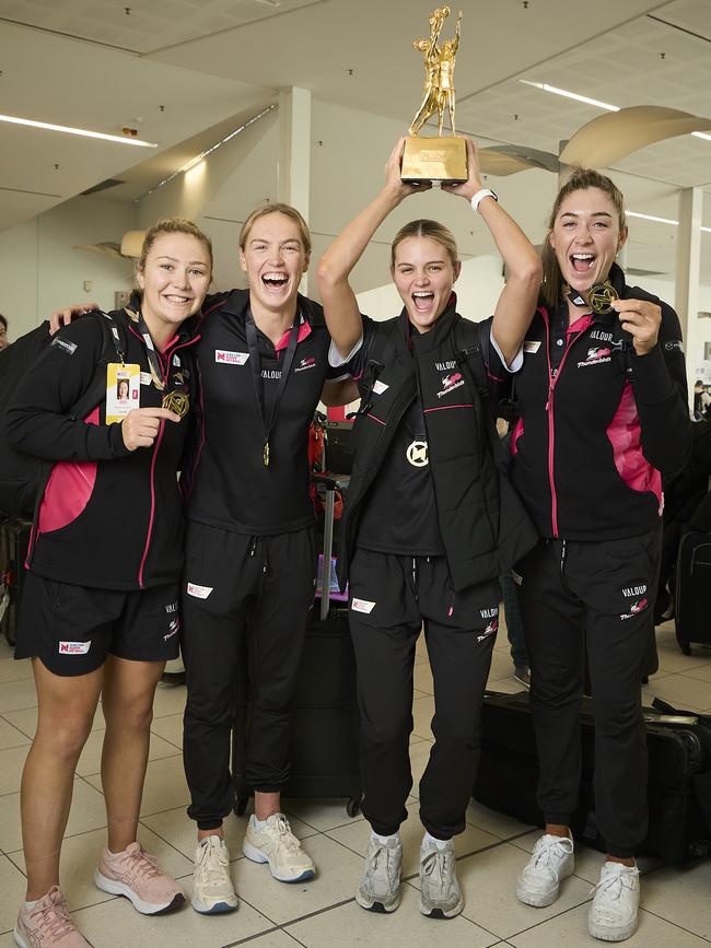 Georgie Horjus, Hannah Petty, Tippah Dwan, and Matilda Garrett from the Thunderbirds returning home at Adelaide Airport. Picture: Matt Loxton