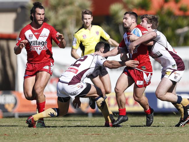 Cameron Cullen of Redcliffe Dolphins is tackled by Matthew Robinson (left) and Tyler Sparks of Burleigh Bears in the Intrust Super Cup rugby league match played at the Dolphins stadium, Redcliffe, Brisbane, Saturday, July 14, 2018. (AAP Image/Regi Varghese)