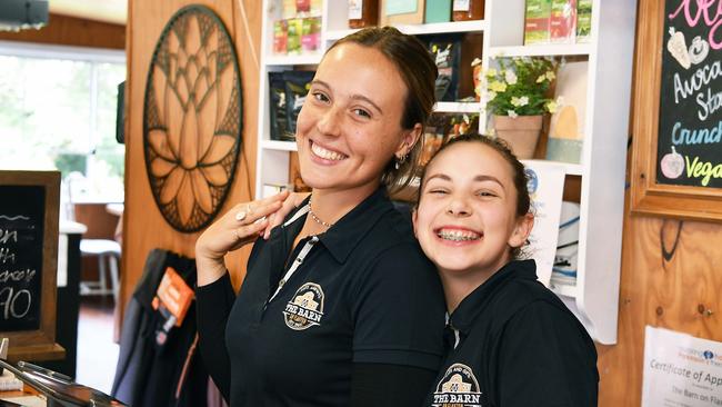 Abigail Coomber and Olivia Claridge were all smiles after it was confirmed the cafe would remain open. Photo: Patrick Woods.