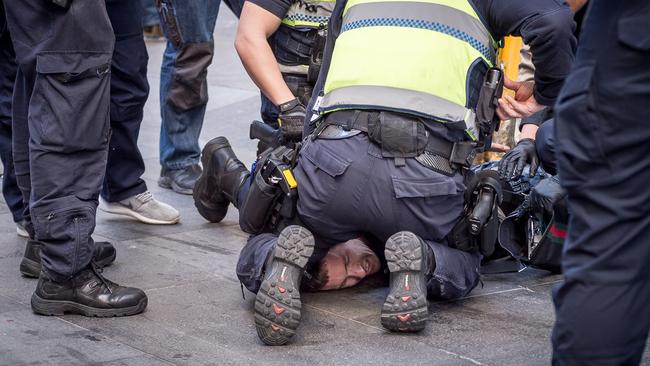 Police arrest the man. Picture: Jake Nowakowski