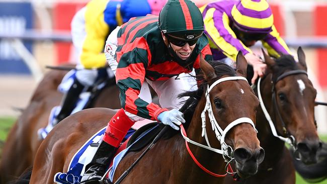 Craig Williams celebrates after riding September Run to victory in the Coolmore Stud Stakes at Flemington on Victoria Derby Day. Picture: Getty Images