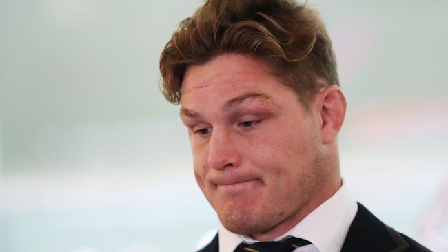 Wallabies captain Michael Hooper speaks to the media arriving home at Sydney Airport after a disastrous 2019 World Cup campaign in Japan. Picture: Brett Costello