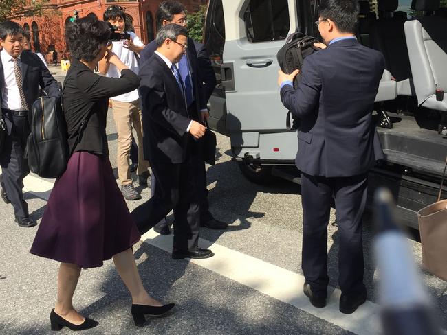 Members of a Chinese delegation led by the Vice Minister of Commerce and Deputy China International Trade Representative Wang Shouwen (C) leave the building of the US Treasury after two days of talks with US representatives in Washhington DC on August 23, 2018. - US Treasury's David Malpass, undersecretary for international affairs, is leading two days of talks with China's Vice Commerce Minister Wang Shouwen and Vice Finance Minister Liao Min as thousands of American and Chinese products became 25 percent more expensive overnight on Thursday. Washington hit China with punitive duties on another $16 billion in goods, triggering a swift tit-for-tat retaliation from Beijing. (Photo by Virgine MONTET / AFP)